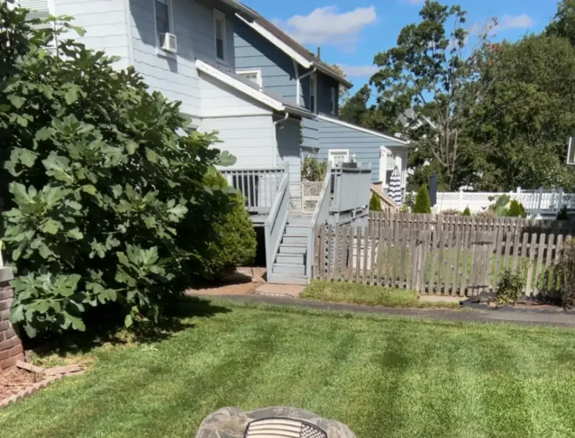 Freshly mowed Bergen County lawn with crisp mowing stripes by World Class Landscaping