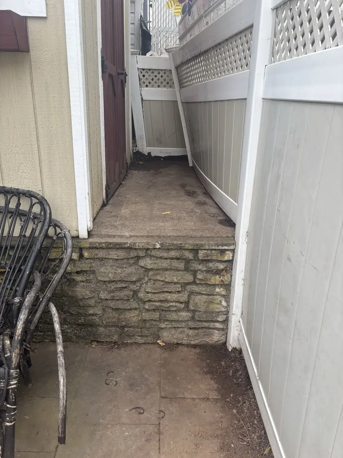 Same fence line after vine removal and cleanup by World Class Landscaping